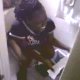 A black girl is video recorded while she is finishing up her shit in the bathroom. She is a good sport about it and gets off of the toilet to show us her finished product!
